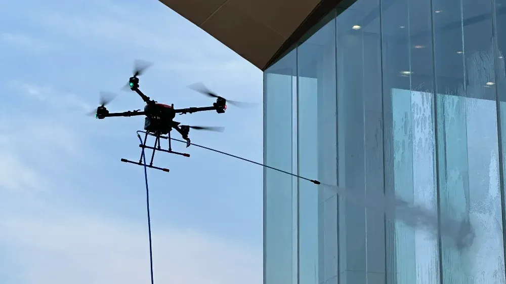 Hose-Fed Cleaning Drone